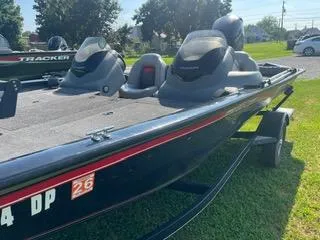 Slide: The Image of 2016 Tracker Pro Team 195 TXW boat on trailer, parked on grass. - 16
