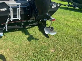 Slide: The Image of 2016 Tracker Pro Team 195 TXW boat on grass, showing rear and propeller. - 3