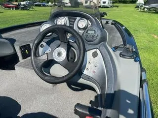 Slide: The Image of 2016 Tracker Pro Team 195 TXW boat dashboard with steering wheel and gauges. - 7