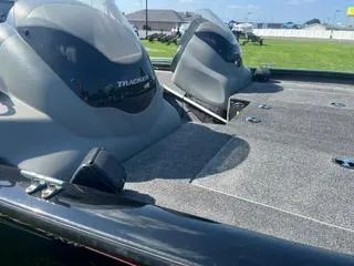 Slide: The Image of 2016 Tracker Pro Team 195 TXW boat with dual consoles on a sunny day. - 8