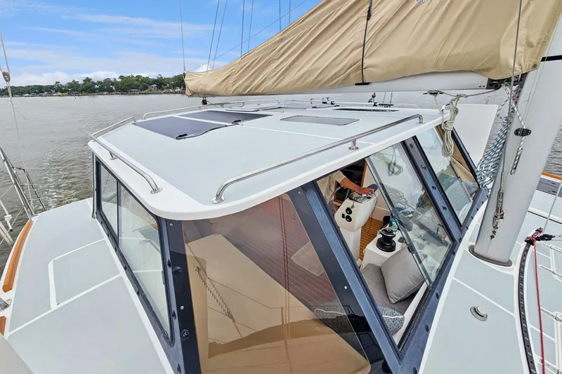 Slide: The Image of 2018 Maine Cat 38 LS sailboat with sleek design and spacious cockpit. - 18