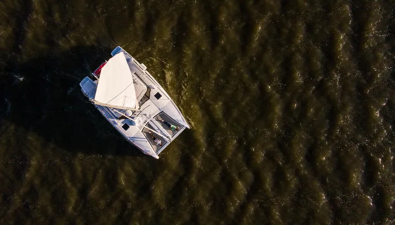 Slide: The Image of Aerial view of 2018 Maine Cat 38 LS sailing on rippling water. - 2