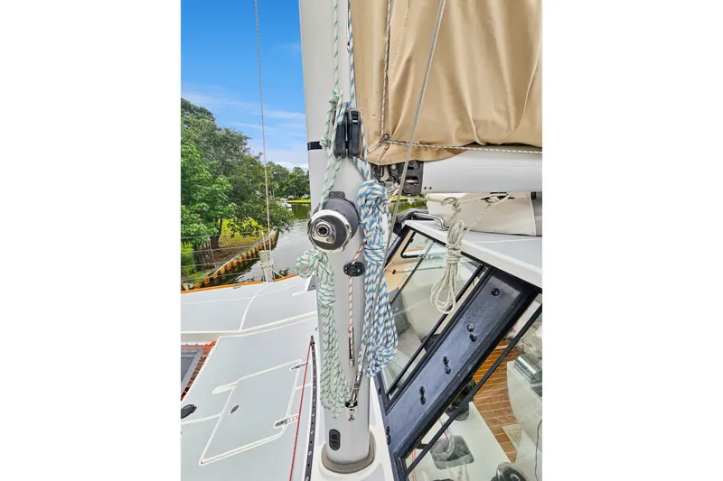 Slide: The Image of 2018 Maine Cat 38 LS sailboat mast with rigging and ropes on deck. - 21