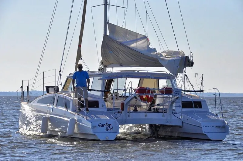Slide: The Image of 2018 Maine Cat 38 LS catamaran sailing on open water, rear view. - 3