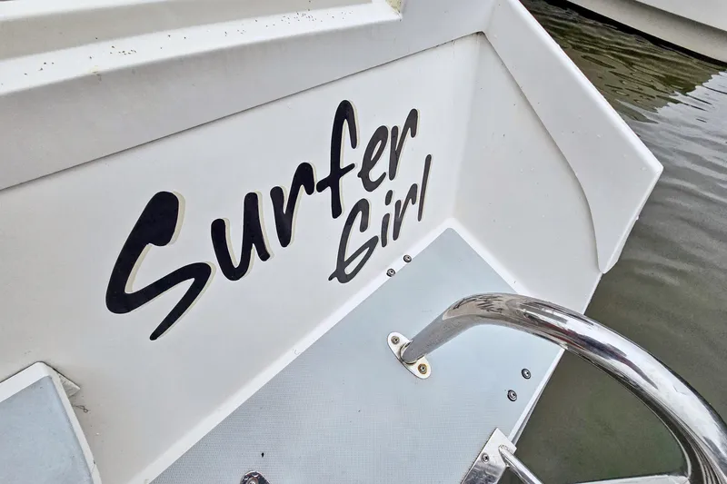 Slide: The Image of 2018 Maine Cat 38 LS boat with "Surfer Girl" name on the stern. - 35