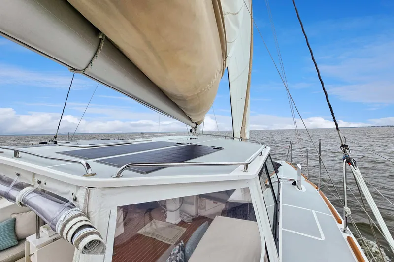 Slide: The Image of Sailing on a 2018 Maine Cat 38 LS catamaran with solar panels and clear skies. - 40