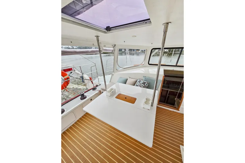 Slide: The Image of 2018 Maine Cat 38 LS interior with seating, table, and scenic water view. - 46