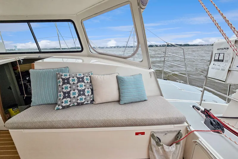 Slide: The Image of 2018 Maine Cat 38 LS interior with cushioned seating and scenic water view. - 47