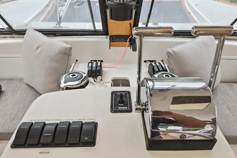 Slide: The Image of Control panel of a 2018 Maine Cat 38 LS boat with throttle levers and switches. - 55