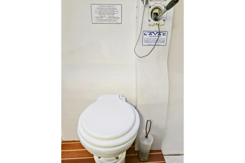Slide: The Image of Marine toilet in 2018 Maine Cat 38 LS, featuring Lavac system and wooden flooring. - 72