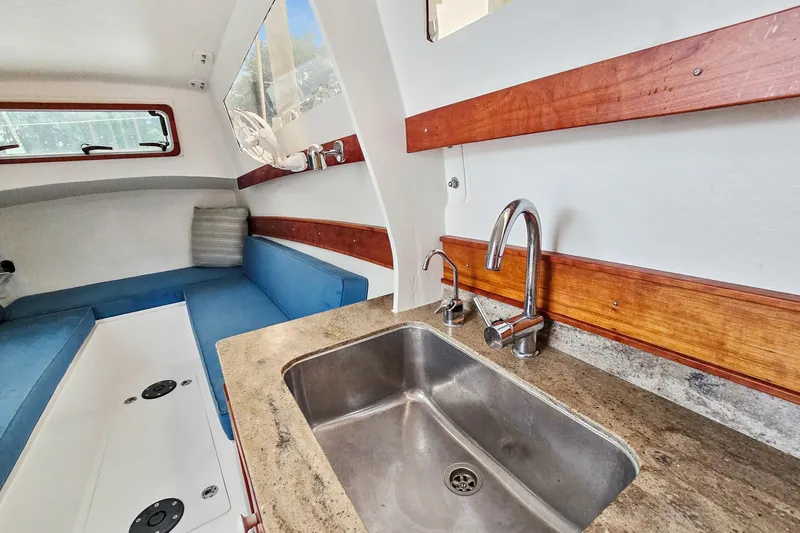 Slide: The Image of Interior of 2018 Maine Cat 38 LS with sink and seating area. - 77