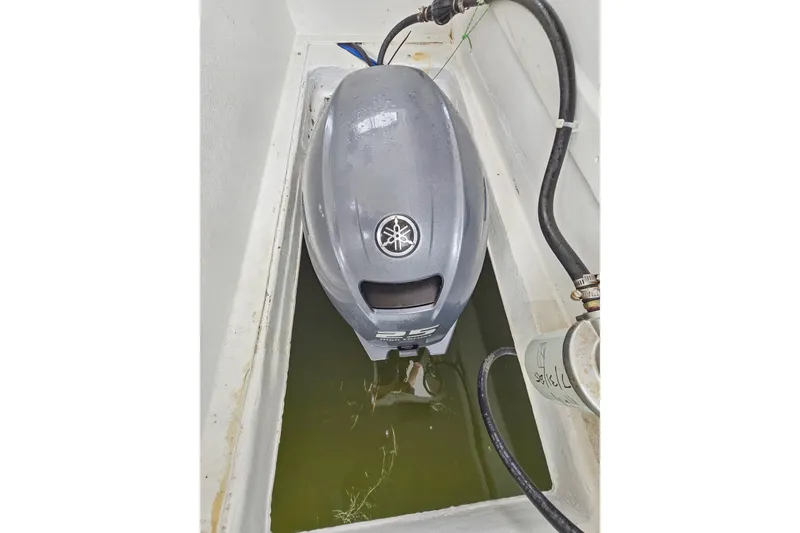 Slide: The Image of Yamaha outboard motor in a 2018 Maine Cat 38 LS boat compartment. - 81