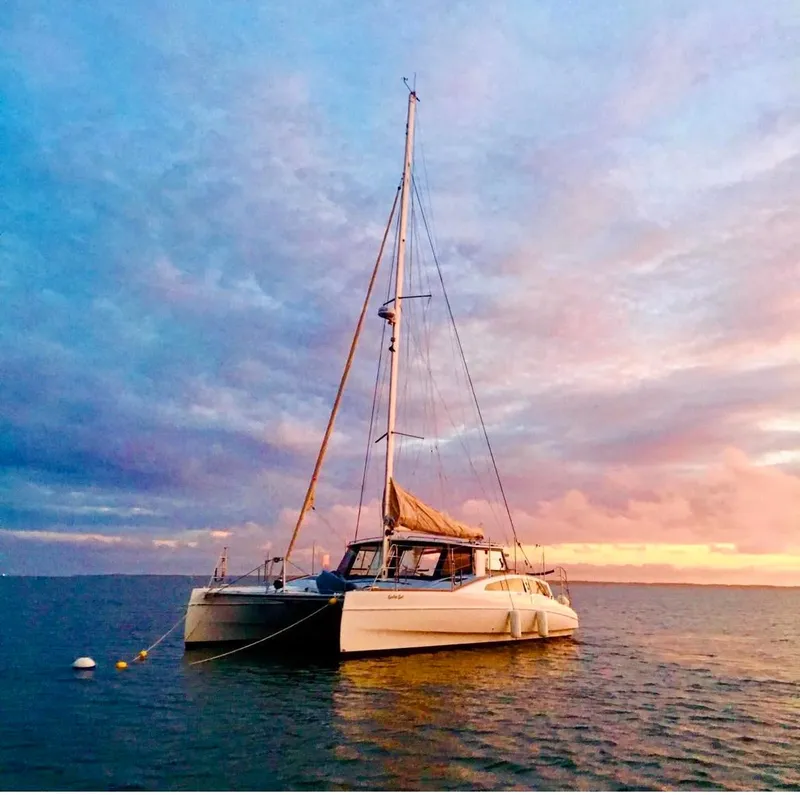 Slide: The Image of 2018 Maine Cat 38 LS catamaran at sunset on calm waters. - 84