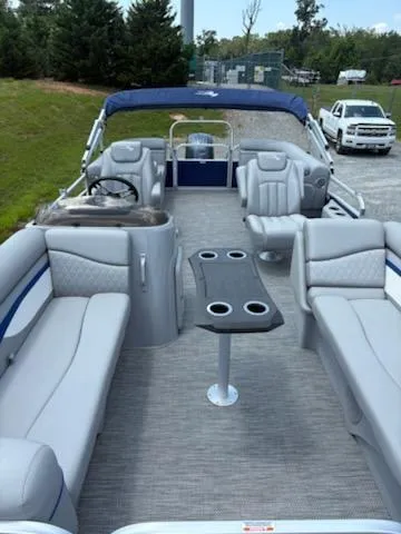 Slide: The Image of 2024 Bennington 22SVSR pontoon boat with spacious seating and modern interior design. - 6