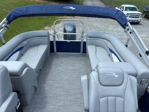 Slide: The Image of 2024 Bennington 22SVSR pontoon boat with spacious seating and modern design. - 7