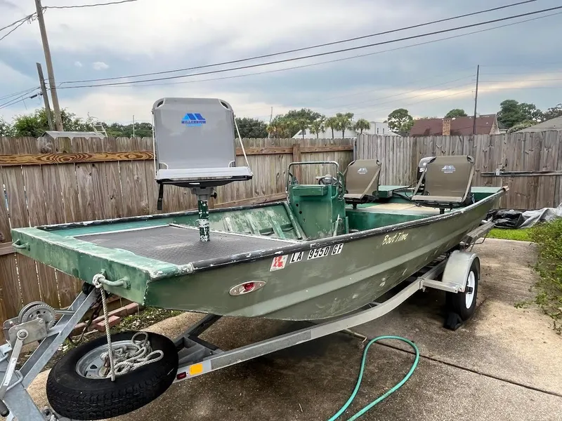 The Image of Custom Flat 16 boat on trailer, 2016 model, parked in driveway. - 0