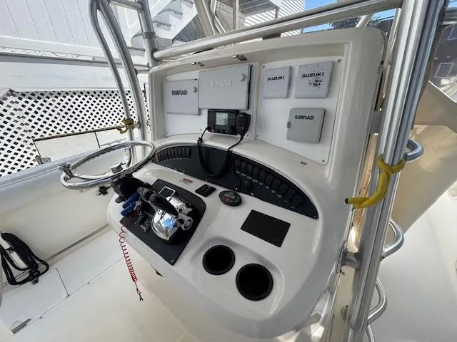 Slide: The Image of Helm of 2004 Boston Whaler 320 Outrage with Simrad electronics and Suzuki controls. - 10