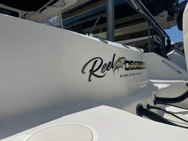 Slide: The Image of 2004 Boston Whaler 320 Outrage boat with "Reel Obsession" logo, Shark River Inlet, NJ. - 6