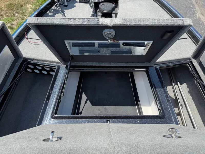 Slide: The Image of 2019 Nitro Z21 boat storage compartments open, showcasing spacious interior and organized layout. - 14