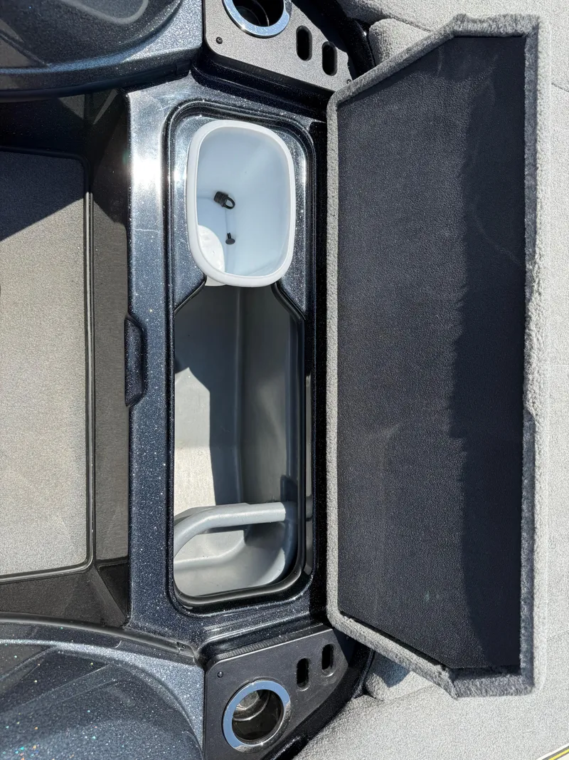 Slide: The Image of 2019 Nitro Z21 boat storage compartment with open lid, showcasing interior design and features. - 15