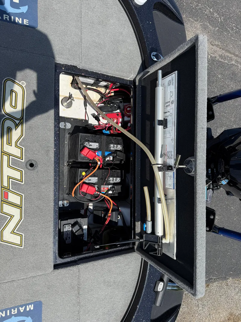 Slide: The Image of 2019 Nitro Z21 boat battery compartment with wiring and components visible. - 17
