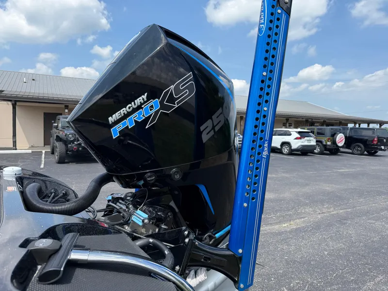 Slide: The Image of 2019 Nitro Z21 boat with Mercury Pro XS 250 engine in parking lot. - 21