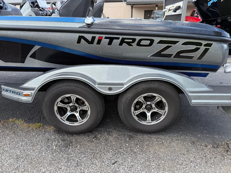 Slide: The Image of 2019 Nitro Z21 boat trailer with dual wheels and sleek design. - 22