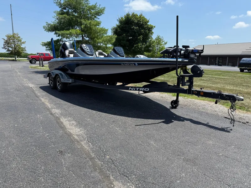 Slide: The Image of 2019 Nitro Z21 boat on trailer in parking lot, sunny day. - 6
