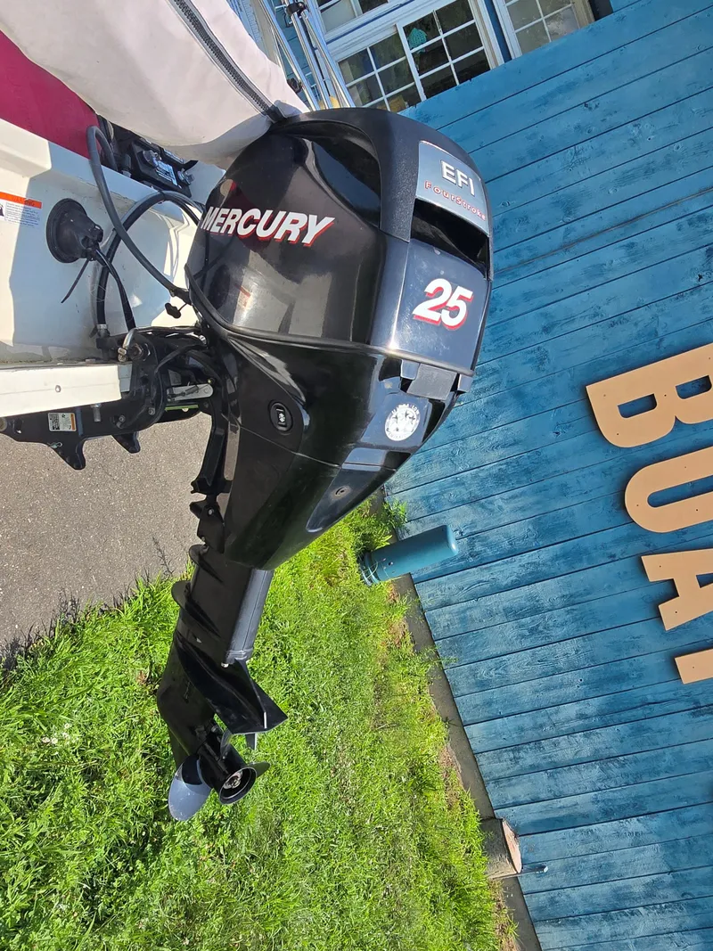 Slide: The Image of Mercury EFI 25 outboard motor on a Lowe AN160S boat, 2012 model. - 4