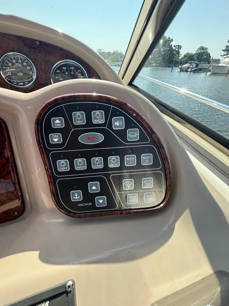 Slide: The Image of Control panel of a 2004 Sea Ray 320 Sundancer boat with water view. - 19