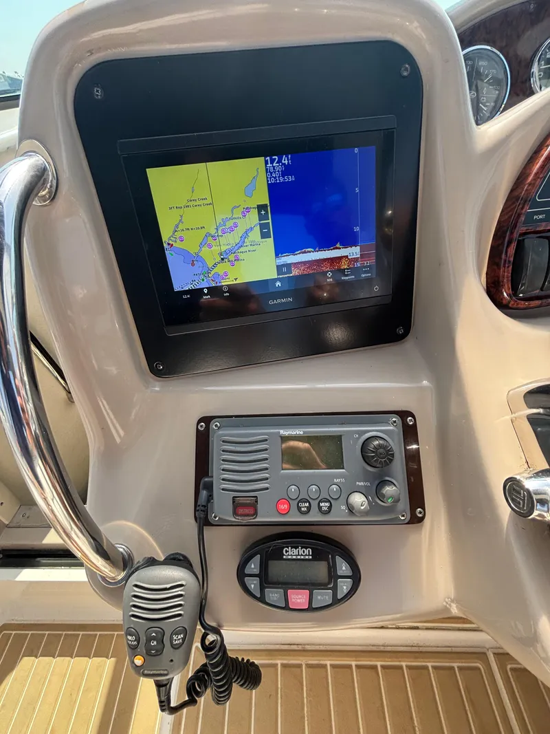 Slide: The Image of Dashboard of 2004 Sea Ray 320 Sundancer with Garmin navigation and communication equipment. - 20