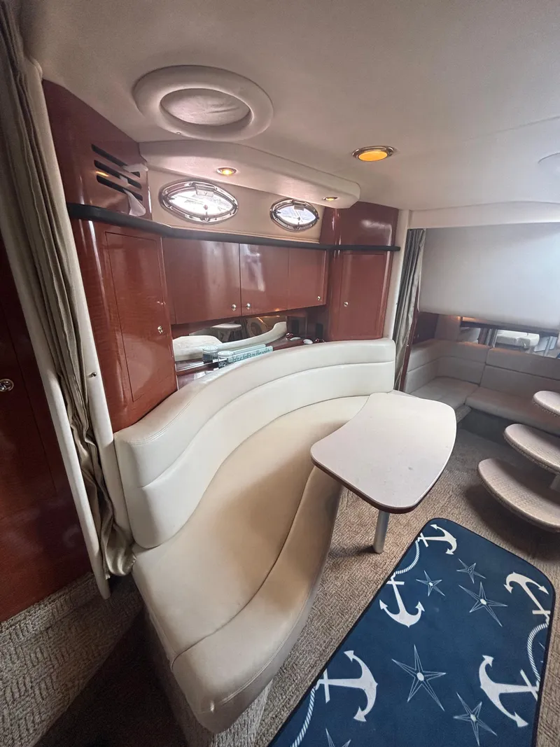 Slide: The Image of Interior of 2004 Sea Ray 320 Sundancer yacht with elegant seating and nautical decor. - 28