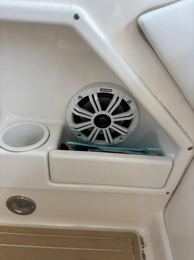 Slide: The Image of Speaker and storage compartment on a 2004 Sea Ray 320 Sundancer boat. - 45