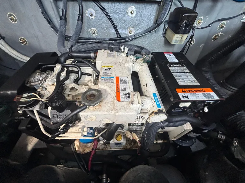 Slide: The Image of Engine compartment of a 2004 Sea Ray 320 Sundancer with Kohler power system. - 49