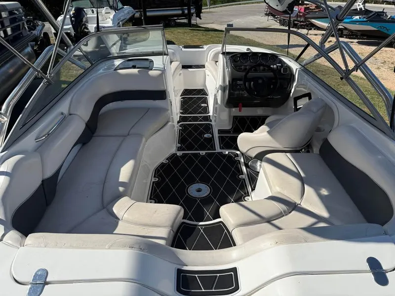 Slide: The Image of 2007 Yamaha Boats SX210 interior with white seating and black flooring. - 5