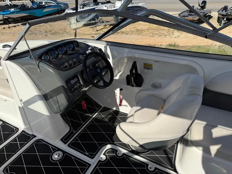 Slide: The Image of 2007 Yamaha Boats SX210 cockpit with steering wheel and seating, featuring black and white interior. - 6