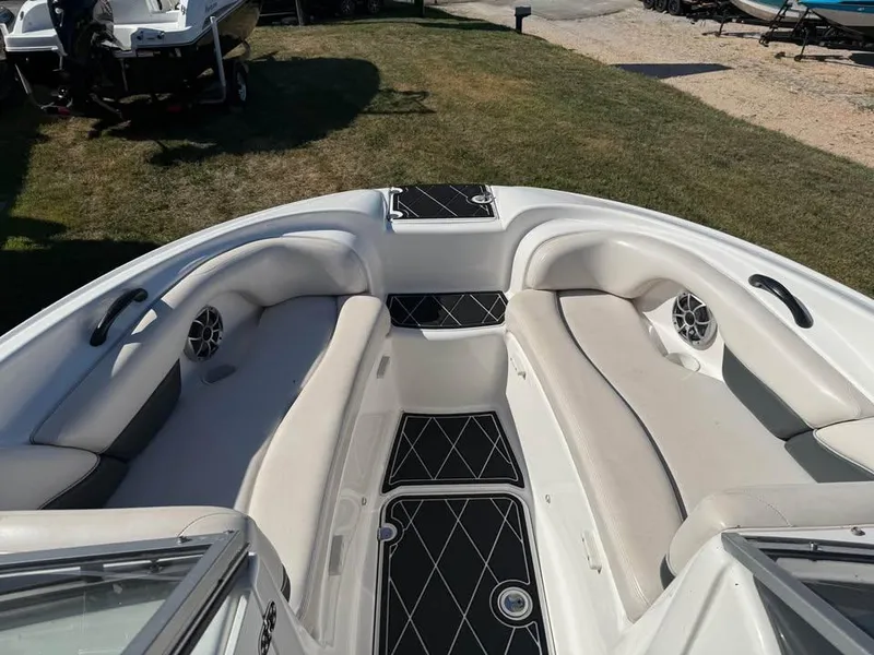 Slide: The Image of 2007 Yamaha Boats SX210 interior with cushioned seating and speakers. - 8