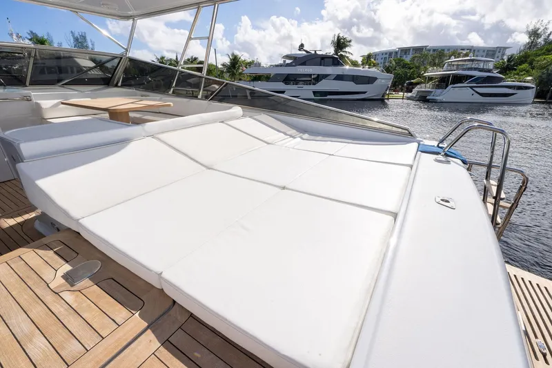 Slide: The Image of Luxurious 1995 Itama 46 yacht with spacious sunbathing deck and scenic marina view. - 10