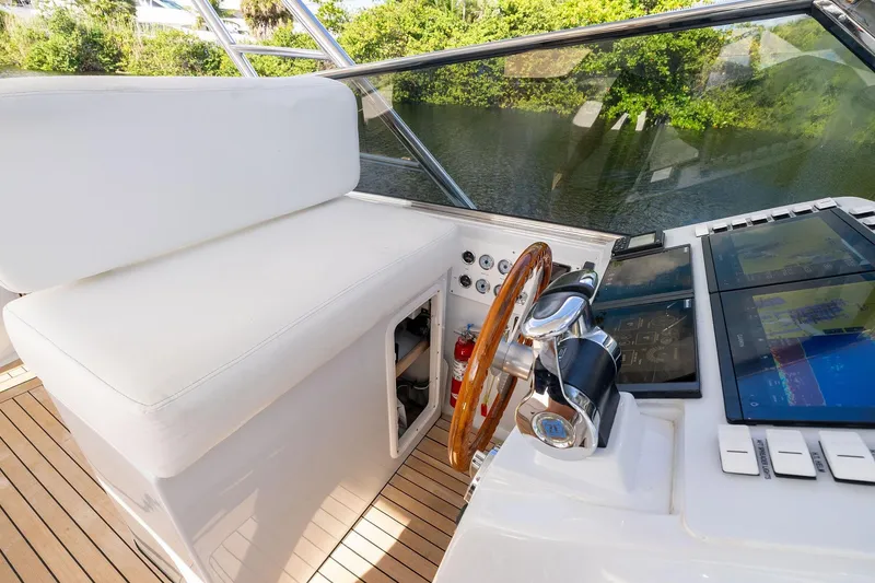 Slide: The Image of Cockpit of 1995 Itama 46 yacht with wooden steering wheel and modern controls. - 20