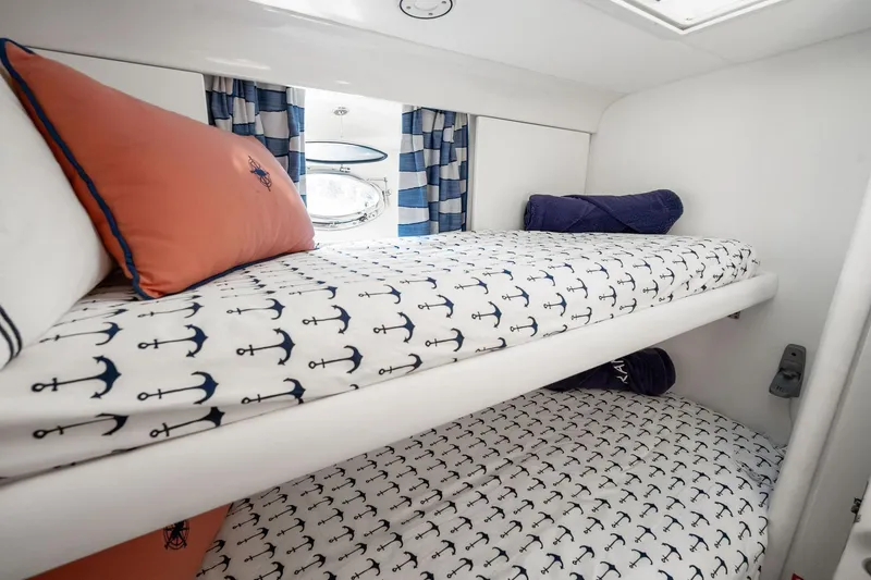 Slide: The Image of Cozy cabin with anchor-themed bedding in a 1995 Itama 46 yacht. - 29