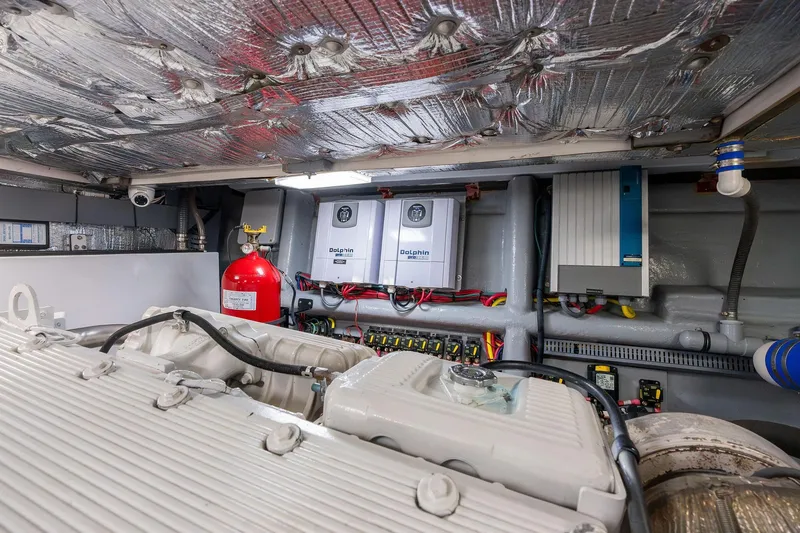 Slide: The Image of Engine room of a 1995 Itama 46 yacht, featuring equipment and fire safety system. - 37