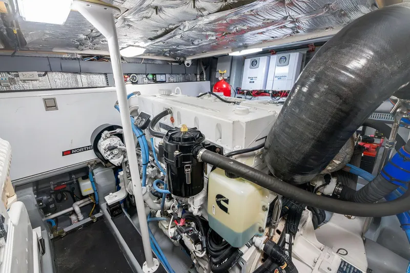 Slide: The Image of Engine room of a 1995 Itama 46 yacht, featuring Cummins engine and Dolphin equipment. - 40