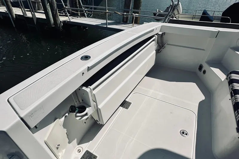 Slide: The Image of 2007 Sabreline 34 Express boat deck with seating and dock view. - 14