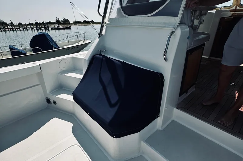 Slide: The Image of 2007 Sabreline 34 Express boat interior with seating and deck view. - 18