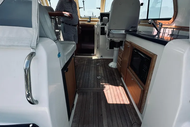 Slide: The Image of Interior of 2007 Sabreline 34 Express yacht with wood flooring and kitchenette. - 26