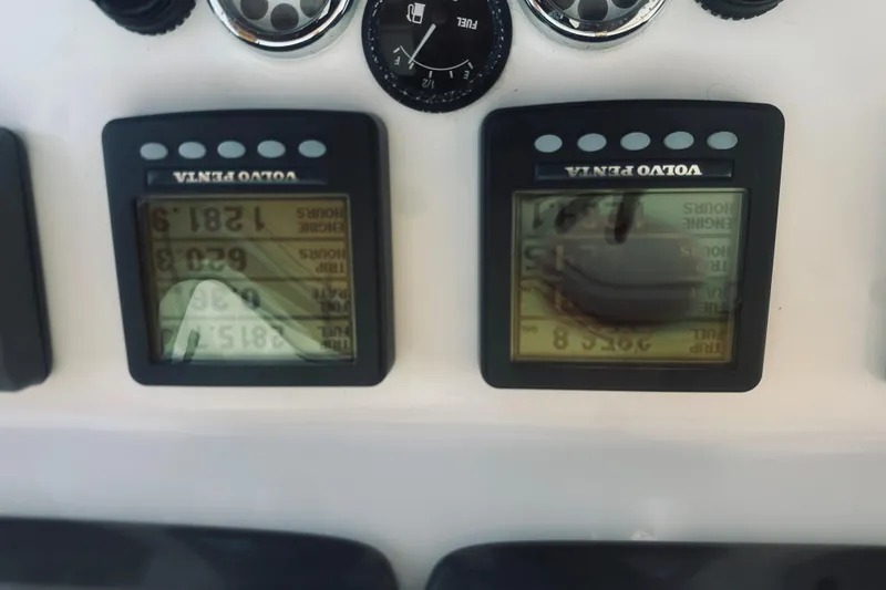 Slide: The Image of Volvo Penta engine displays on 2007 Sabreline 34 Express boat dashboard. - 34