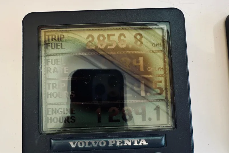 Slide: The Image of Volvo Penta display showing trip fuel, fuel rate, trip hours, and engine hours for 2007 Sabreline 34 Express. - 35