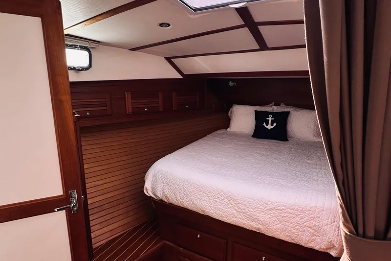 Slide: The Image of Luxurious cabin interior of 2007 Sabreline 34 Express with cozy bedding and nautical decor. - 54