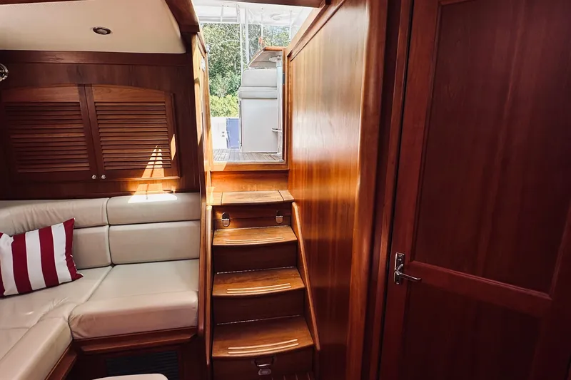 Slide: The Image of Interior of 2007 Sabreline 34 Express yacht with wooden finish and cozy seating. - 59