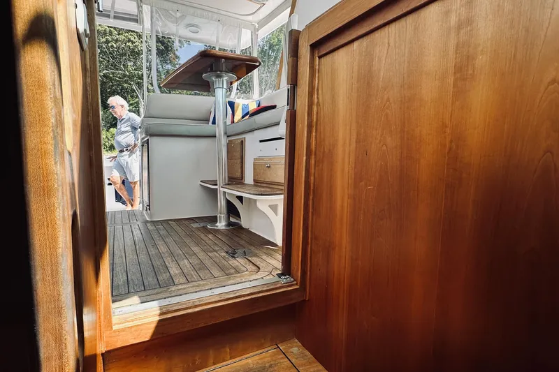 Slide: The Image of 2007 Sabreline 34 Express interior with wooden finish and outdoor view. - 67